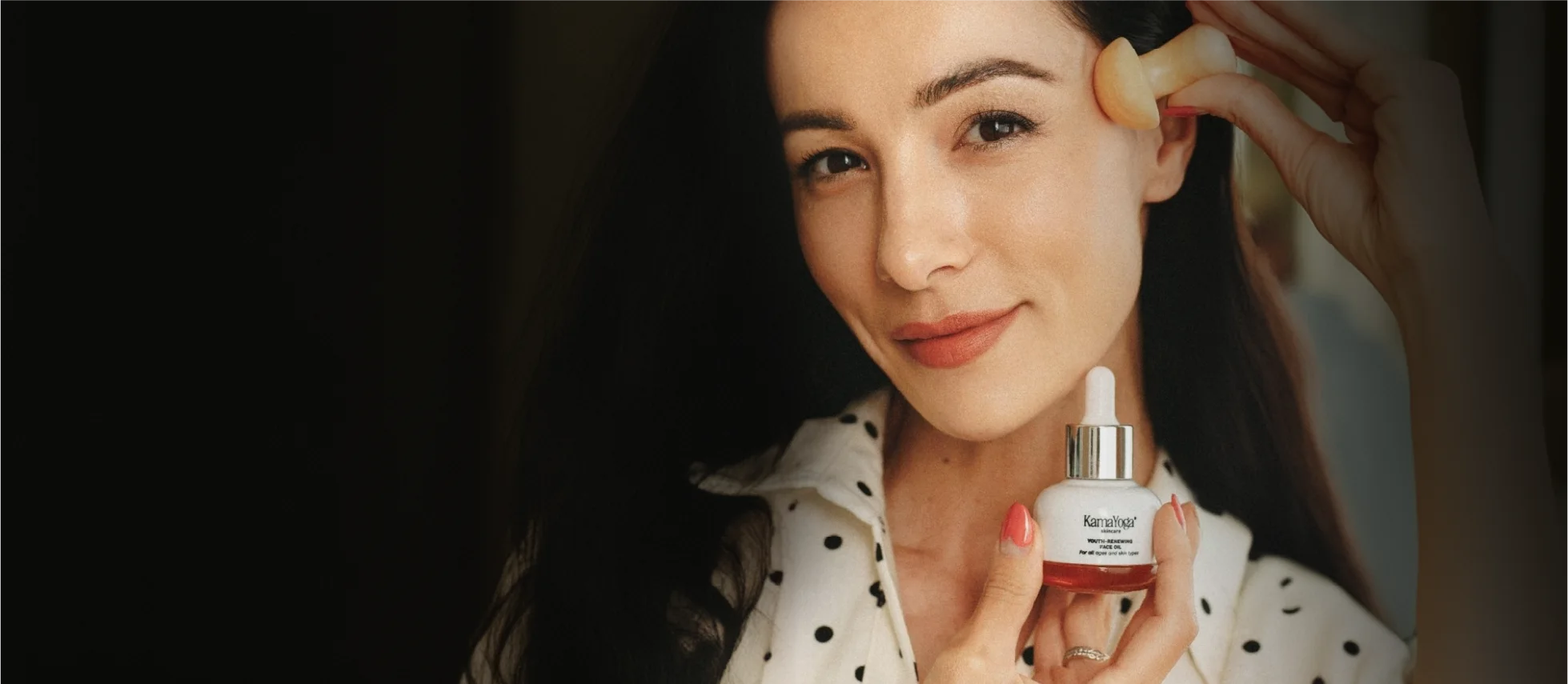 Woman with radiant glowing skin using luxury ayurvedic anti-aging skincare