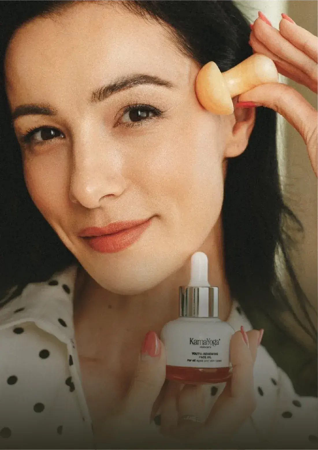 Woman with radiant glowing skin using luxury ayurvedic anti-aging skincare